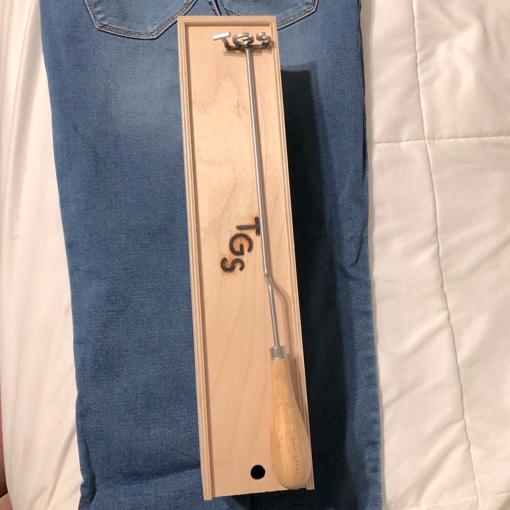 Steak branding iron in wooden box with initials “T G S”